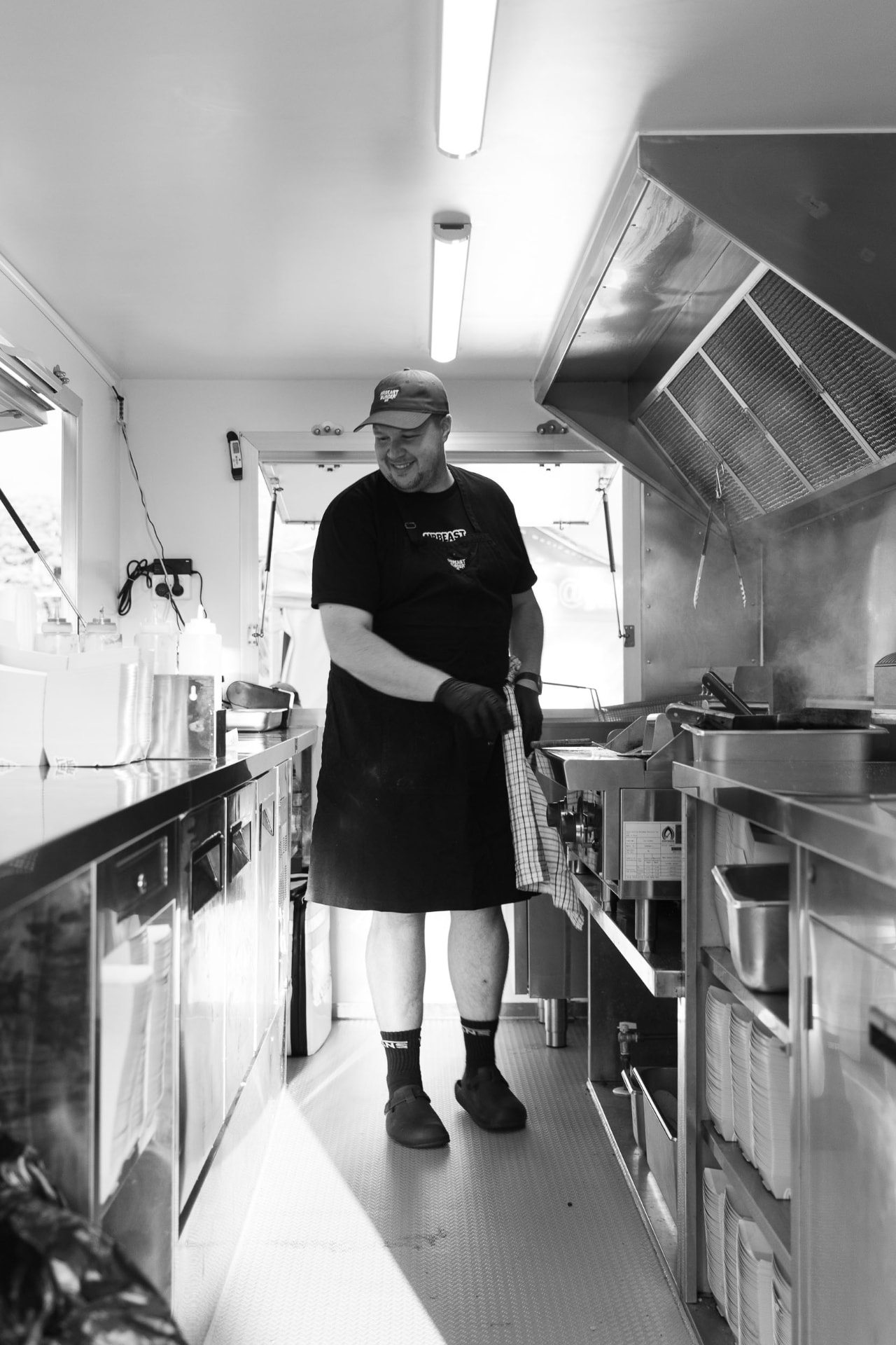 Chef running service inside a mobile kitchen unit